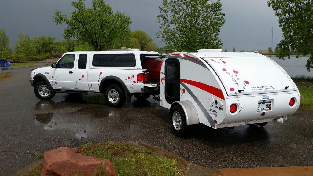 Red poppy decals on White Truck & Teardrop Camper the customer was the decal design and installer