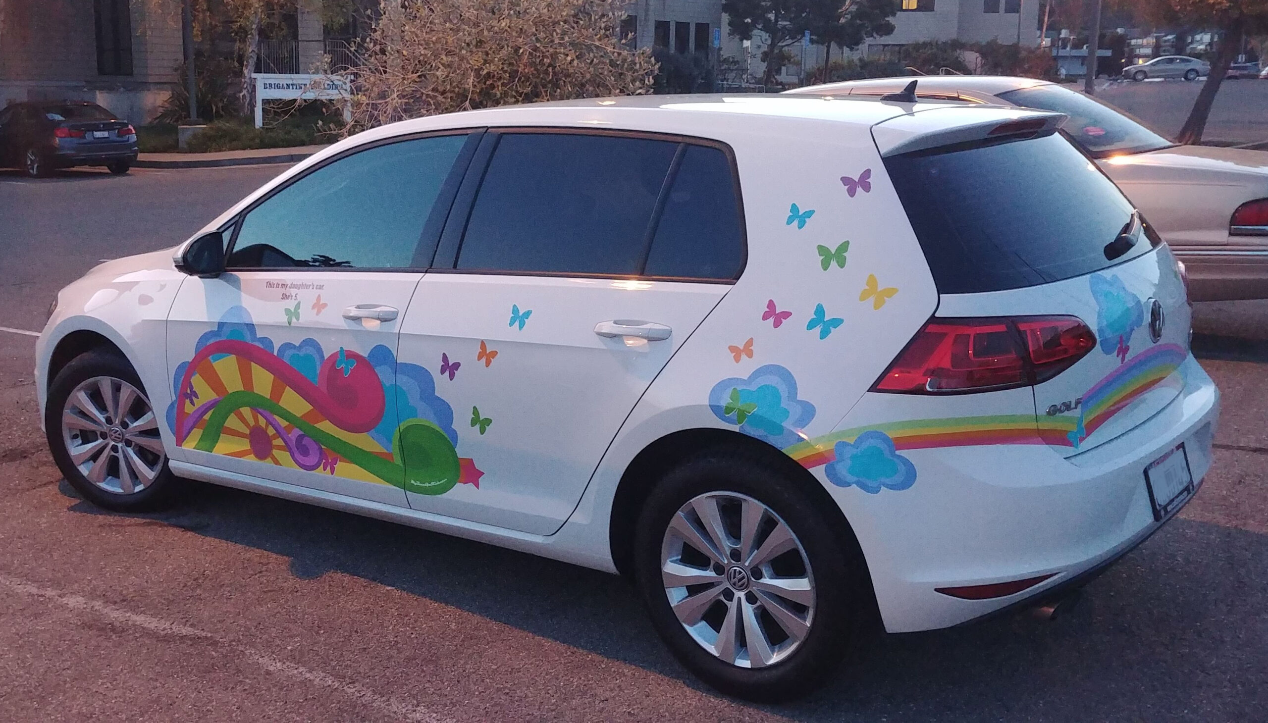 VW Gold with pastel rainbow cloud butterfly decal